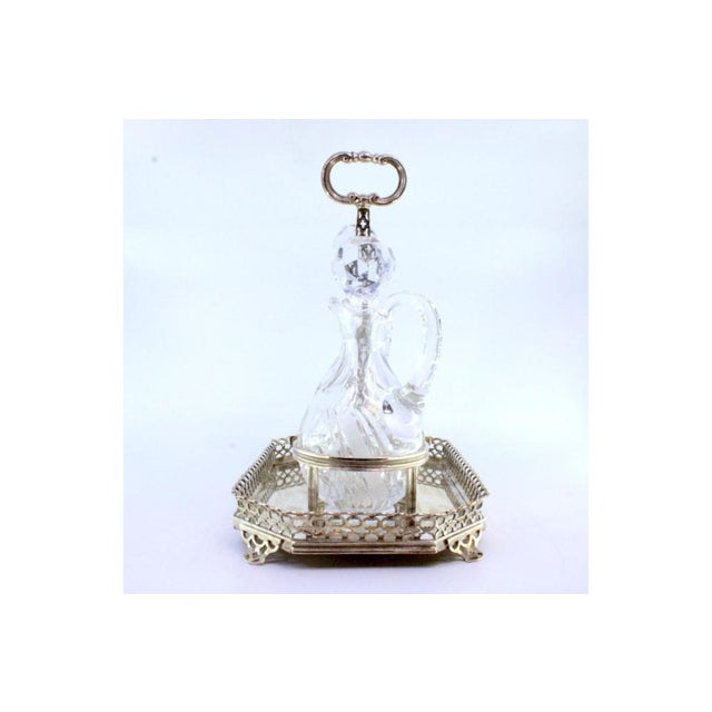 Cruet Set with Silver Structure and Cut Glass Cruets, Set of 3, in Very Good conditions. Designed 1920 to 1949 This piece...