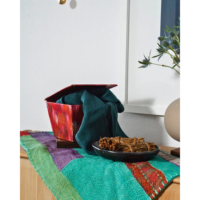 A vivid hand-painted folk art box with a pitched lid and expressive brushwork in red, pink, orange, and touches of pale...