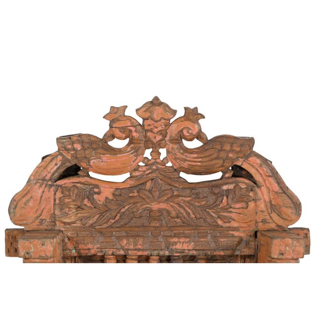 This Antique Indian Carved Teakwood Architectural Mirror is handcrafted from solid teakwood, featuring an elegant arch...