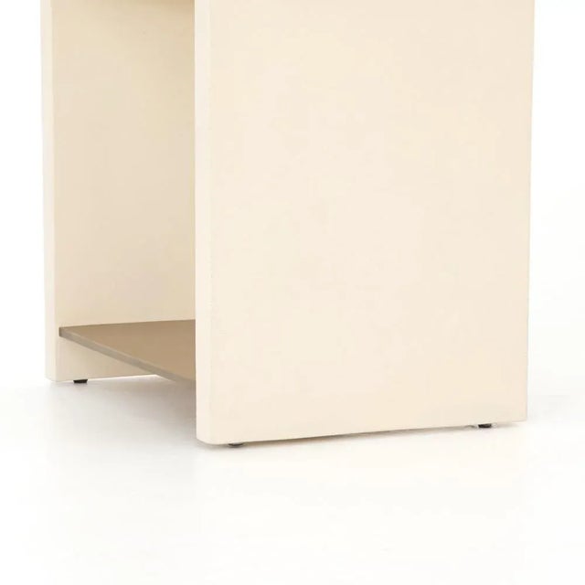 Traditionally outdoor materials are updated for indoor use. An antique brass-finished steel shelf seems to float between a...