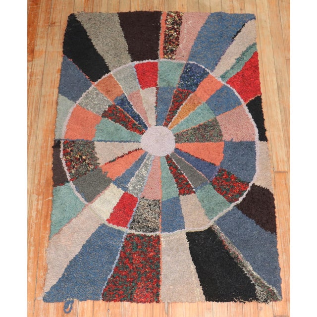 A compelling Mid-20th Century American hooked rug. Measures: 3'2" x 5'11''.