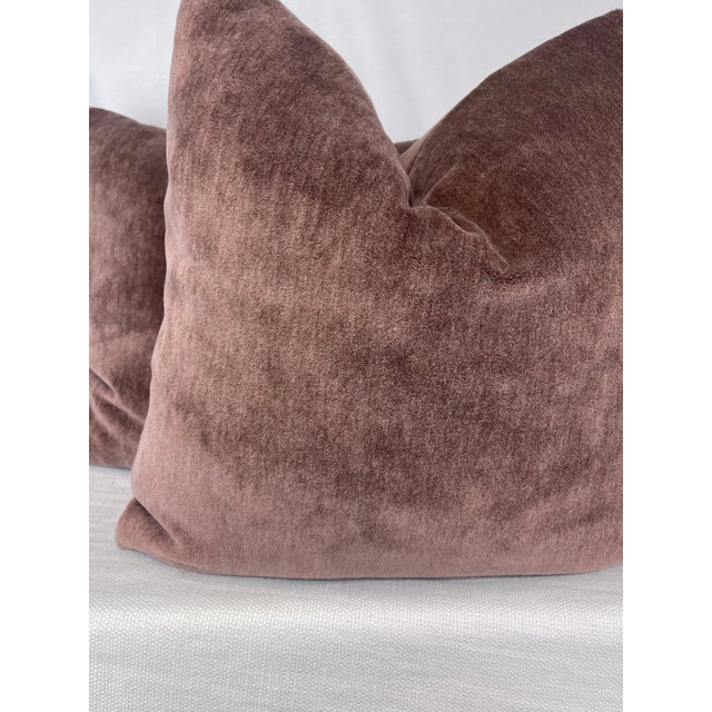 custom pair of 22" pillows covered in a rosewood colored alpaca velvet. These pillows have tapered corners to prevent dog...
