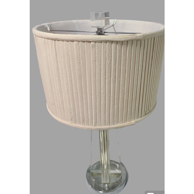 Add a touch of sophistication to your living space with this stunning Mid-Century Modern table lamp. The lamp features a...