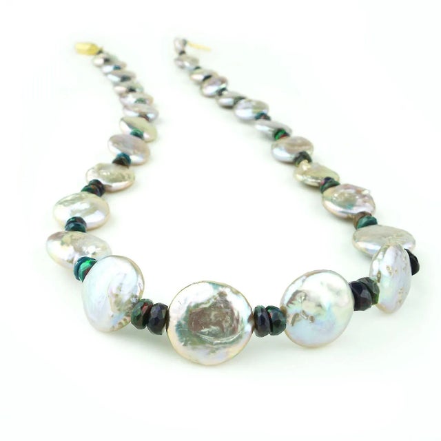 This is part of Chairish’s Fine Jewelry assortment. Elegant 22-Inch Coin Pearl and Black Opal Necklace – Timeless Beauty,...