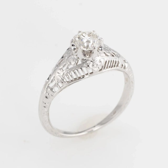 Elegant & finely detailed Art Deco era ring (circa 1920s to 1930s), crafted in 14 karat white gold. Centrally mounted...