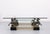 A beautiful square coffee table by Maison Charles from the 1970s. A stylish coffee table, with 4 bronze horses "flying...