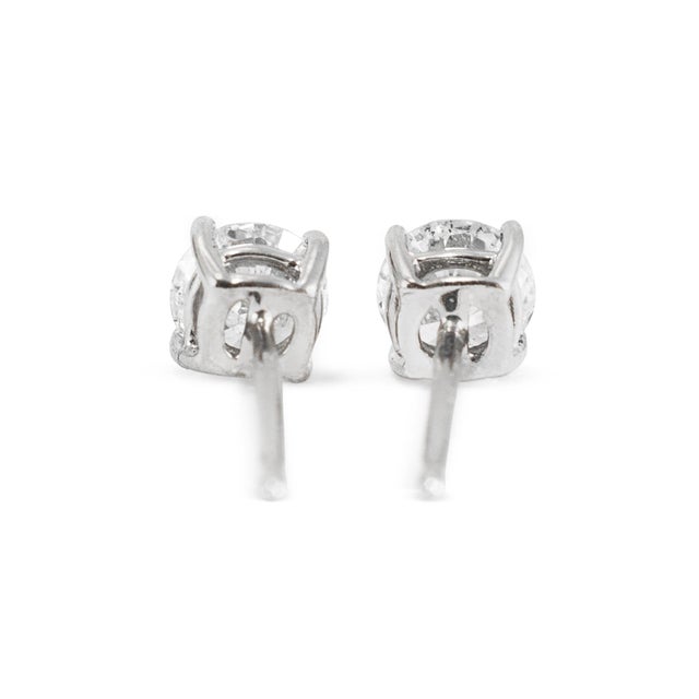 Metal Unisex 18k White Gold 4 Prong Push Back 0.60ct Round Diamond Stud Earrings, A Pair For Sale - Image 7 of 8
