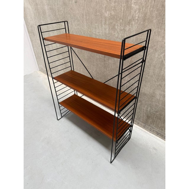 Meet this highly sought-after vintage classic: the standing bookshelf designed in the 1960s by Adriaan Dekker for Tomado...