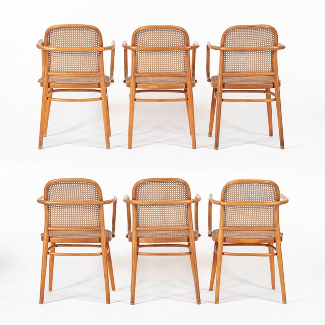 This set of six vintage mid century Bentwood Prague Model 811 cafe dining chairs were made in Czechoslovakia by Ligna...