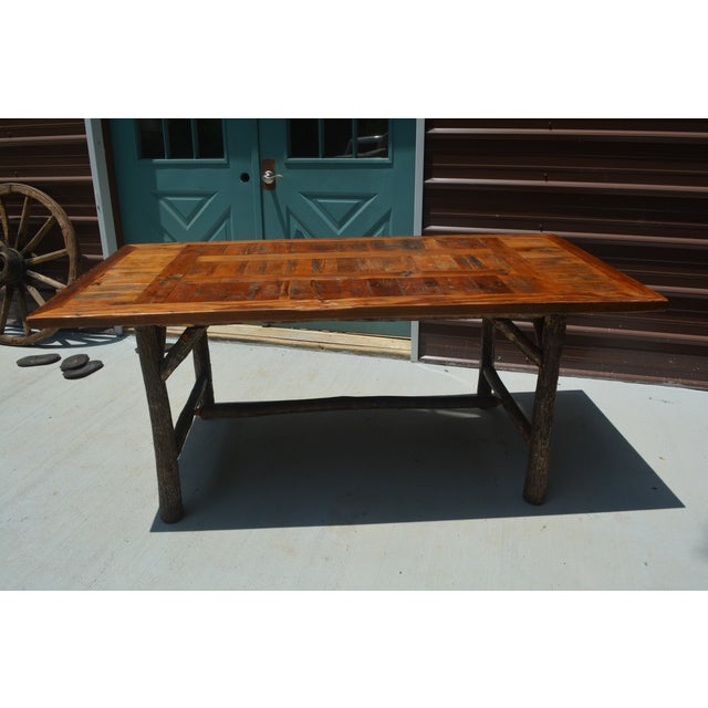 This is a very sturdy / quality log wood dining set. Label has American West. There are 2 arm chairs & 4 side. The seats...