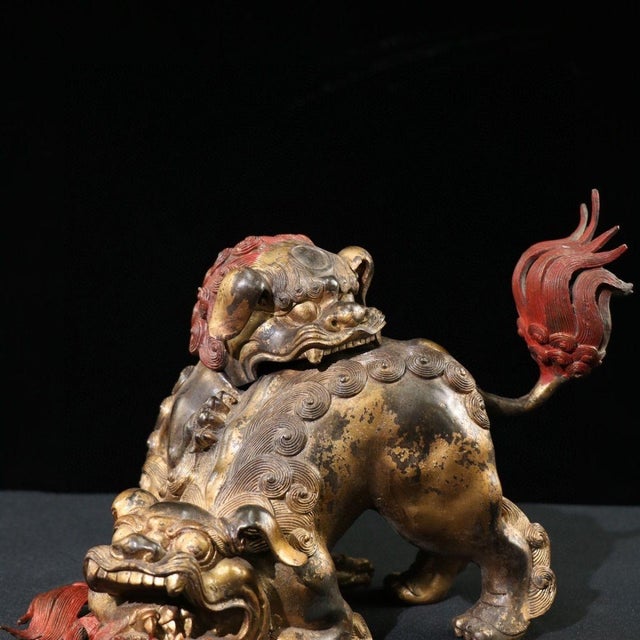 This is a striking vintage gilt bronze guardian lion sculpture, also known as a Foo Dog or wealth lion. The piece features...