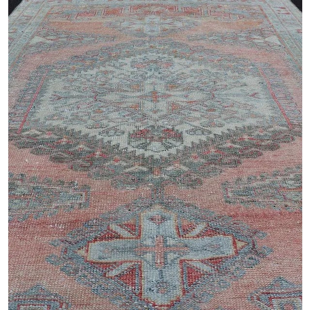 Measures: 3'4 x 5'0. This vintage hand-knotted Persian Hamadan rug features a sub-geometric medallion design enclosed...