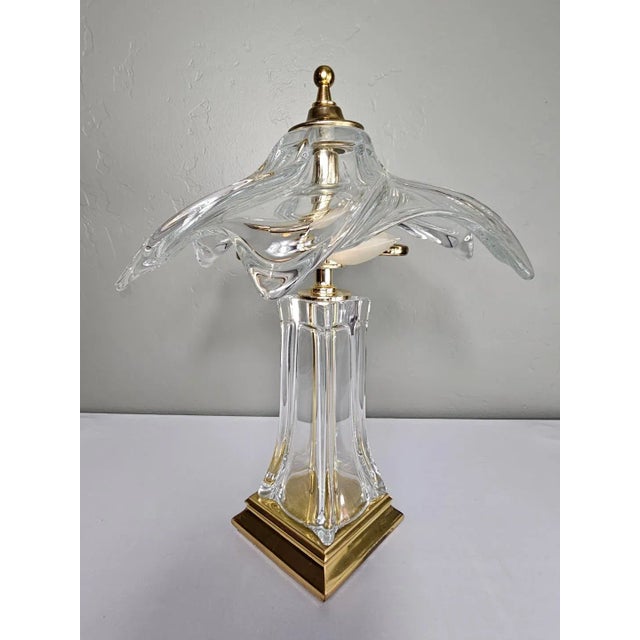 A French crystal and brass desk or table lamp in the modern and Art Nouveau design styles, circa 1960s, Paris, France. The...