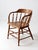 This is an antique captains chair built in the late 1800s. The wooden elbow chair features a classic low barrel back...