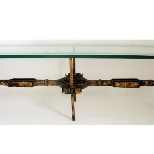 A beautifully crafted example of mid-20th-century Spanish ironwork, this wrought and gilt-iron coffee table combines...