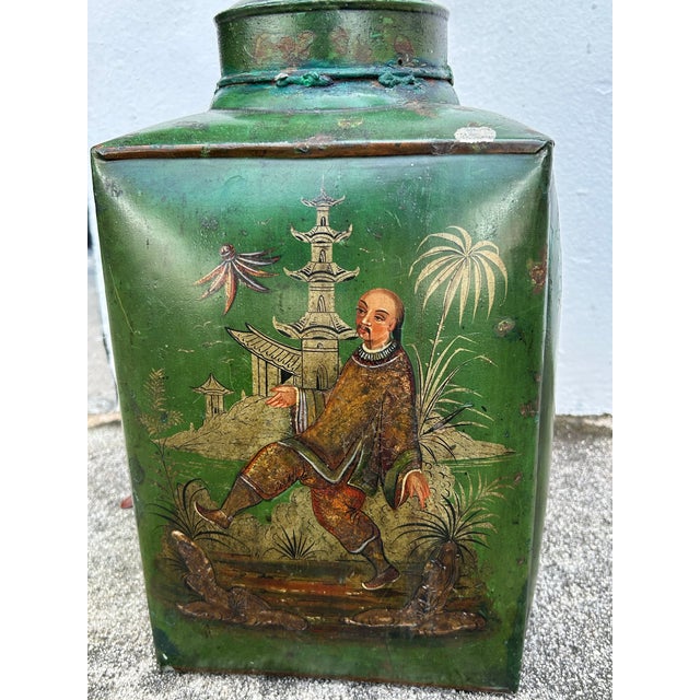 Charming pair of 19th century English tole table lamps hand decorated in Chinoiserie on an alluring green background...