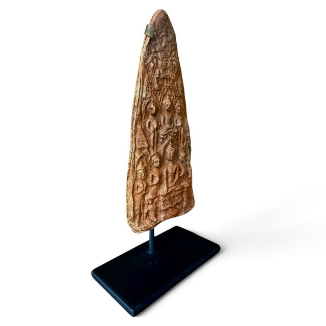 A hand-molded clay tablet depicting numerous deities and Buddhas. Tsa-tsa are objects that are made through an act of...
