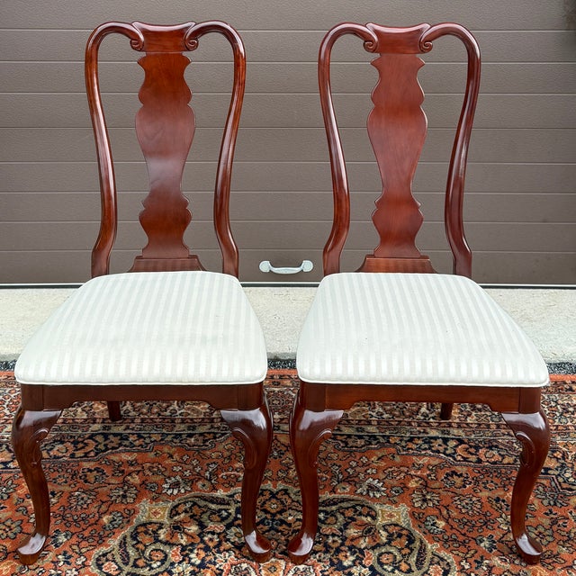 A pair of vintage Sumter Cabinet Co. Traditional Queen Anne solid cherry dining chairs in deep auburn cherry. American...