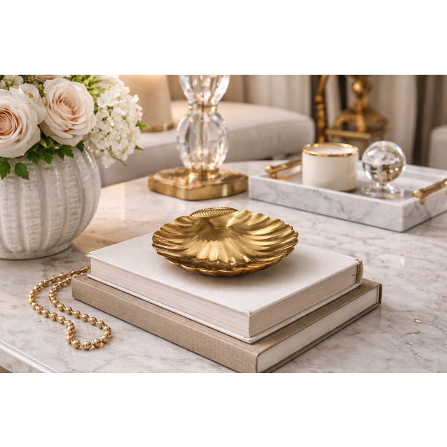 This striking 1970s catch-all bowl captures the era’s love for organic texture and warm metallic accents. Crafted from...