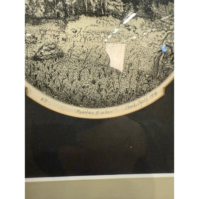 “Mountain Meadow” Etching Print by Egolf 1970. This is also marked an artist proof. We are unable to identify the first...