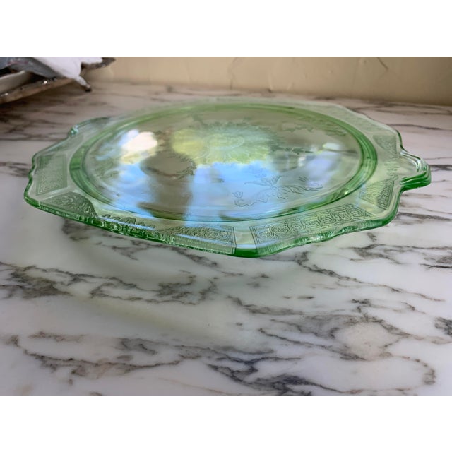 Here we have a vintage green uranium glass cake plate. Made by Anchor Hocking during the depression, circa 1930's. Iconic...
