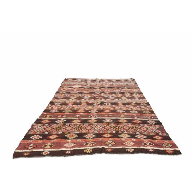 Vintage handwoven decorative kilim rug from Kars region of Turkey. Approximately 50-60 years old. In very good condition.