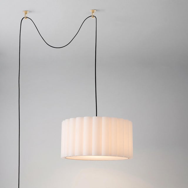Designed by the NOVA Design Team in 2026, the Scallop Swag Lamp is a Modern swag kit featuring a weathered brass steel...