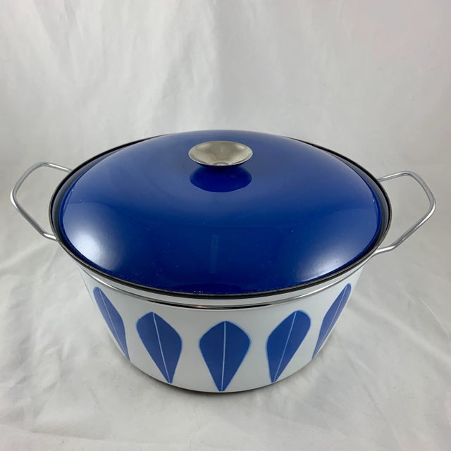 An enamelware Lotus pattern dutch oven manufactured by the Norwegian manufacturer Cathrineholm. Cathrineholm operated from...