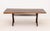 George Nakashima (American, 1905-1990) American Walnut Slab Top Coffee Table, 1962, on four turned wood legs. 17" H x 46"...