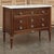 Antique French Louis XVI Mahogany Carrara Marble Top Commode blends elegance with classic, timeless design through fine...