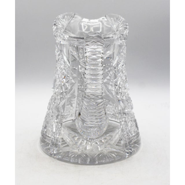 Circa 1896-1916 American brilliant cut glass pitcher. Large & fine; covered with bobstars, swirling stars & crosshatching....