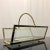 Large magazine holder from the mid century era. Brass plated frame holding 3 glass panes for the sides and bottom....