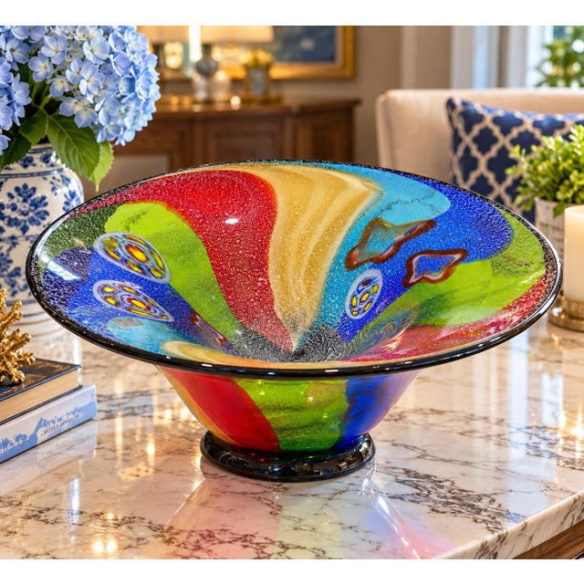 Make a bold statement with this spectacular oversized art glass centerpiece bowl, featuring a vibrant abstract design in...
