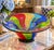 Make a bold statement with this spectacular oversized art glass centerpiece bowl, featuring a vibrant abstract design in...