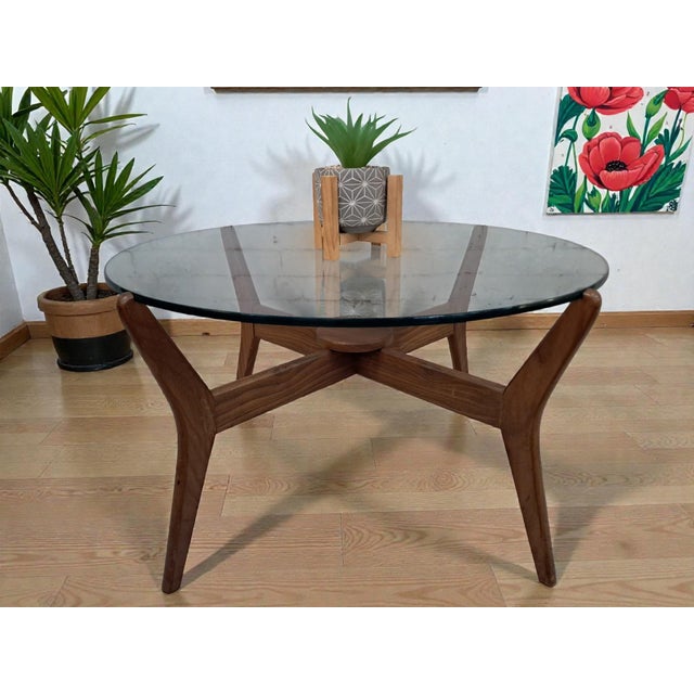 An exceptional mid-century modern round coffee table by lebus, dating from the 1960s and showcasing the refined...