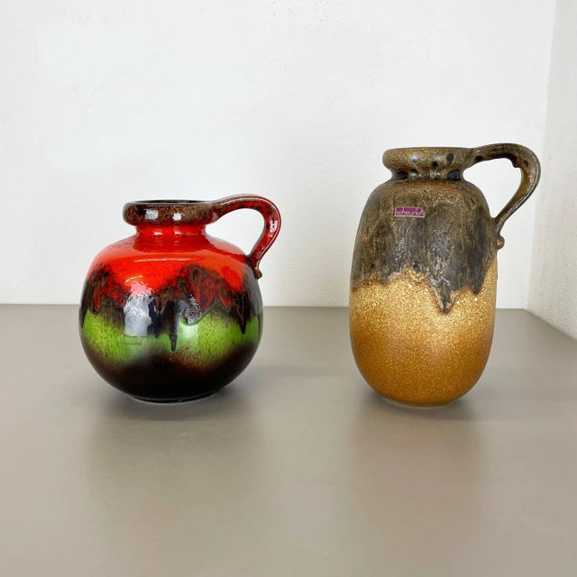 Set of two fat lava art vases Producer: Scheurich, Germany Decade: 1970s These original vintage vases was produced in the...