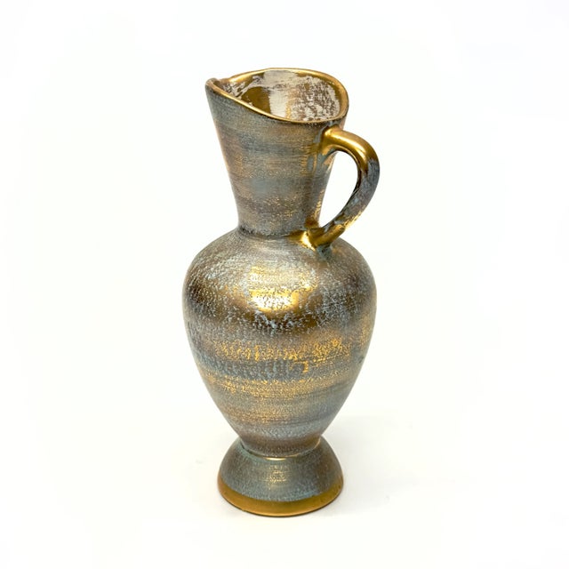 Brushed gold ceramic pitchers, group of 3. This group of mixed-color brushed gold ceramic pitchers come in grey, mint, and...