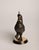 An Art Deco–style animal bronze of a rooster mid-crow, head thrown back, beak open, one leg lifted as if stepping forward...