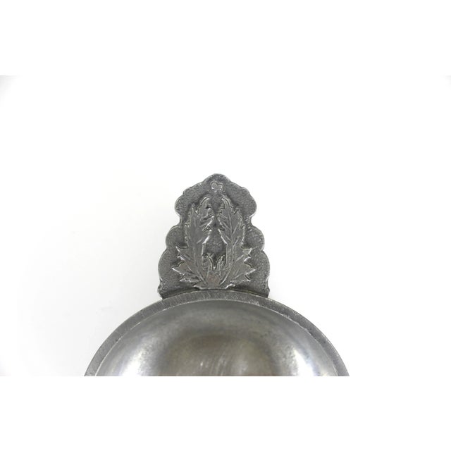 Vintage French pewter porringer with lovely textured leaf detail on the handle. This is thick and heavy and has some nice...