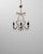 This 20th Century Italian Rococo Revival gilt metal chandelier captures the ornate elegance and expressive curves...