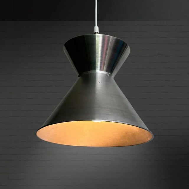 A double cone Laboratory pendant lamp model 16453 designed by the Danish architect Mogens Koch for Louis Poulsen....