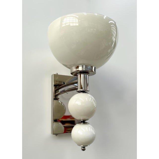 Italian wall light with hand blown cream colored Murano glass, mounted on solid brass frame in polished nickel finish /...