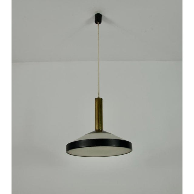 This iconic mid-century ceiling lamp, designed by stilnovo in italy during the 1960s, features a sleek and minimalist...