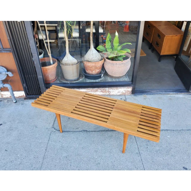 Mid-century style inspired slat coffee table. The table is made out of solid poplar. The legs can be screw on and off for...