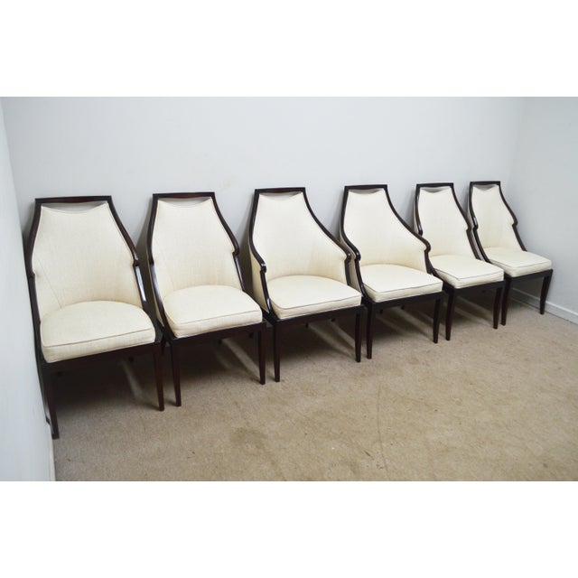 Dining Chairs by Baker Furniture. Store item #539. It features wood frame and fully upholstered. The set consist of two...