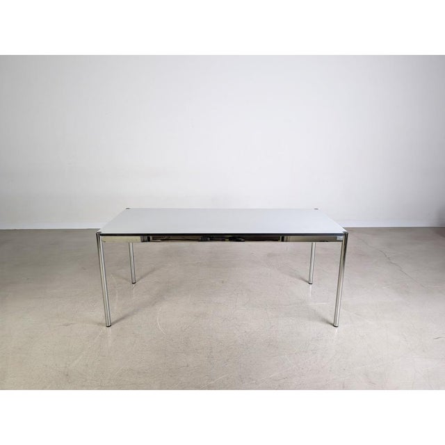 Beautiful USM Haller table. The tables feature removable legs and a simple gray resin tabletop. Condition: Good used...