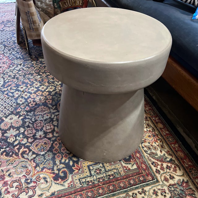 This is a beautiful stone, champagne colored side table. This would be perfect for your living room or beside your bed and...