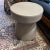 This is a beautiful stone, champagne colored side table. This would be perfect for your living room or beside your bed and...