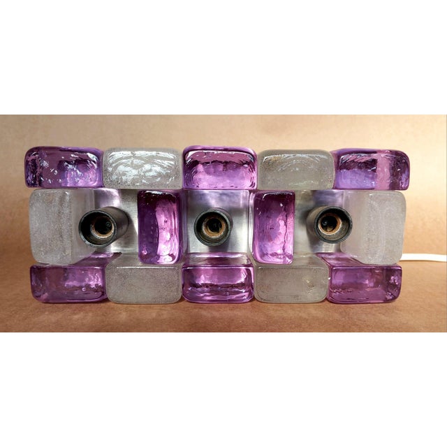 When lit, the effect is very beautiful, especially for the bubbles in the transparent glass. This piece is attributed to...