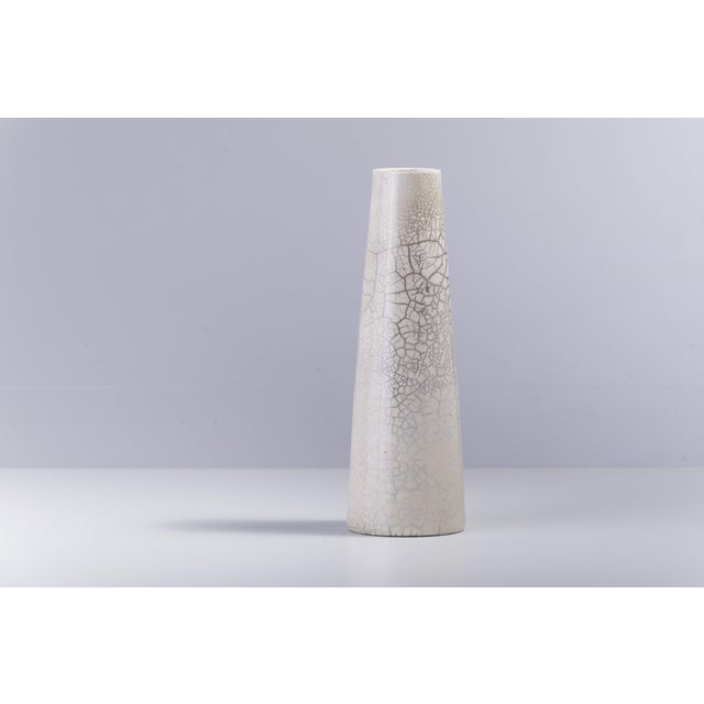 The perfect, stylish addition to any interior setting, this extraordinary vase is entirely handcrafted of ceramic...